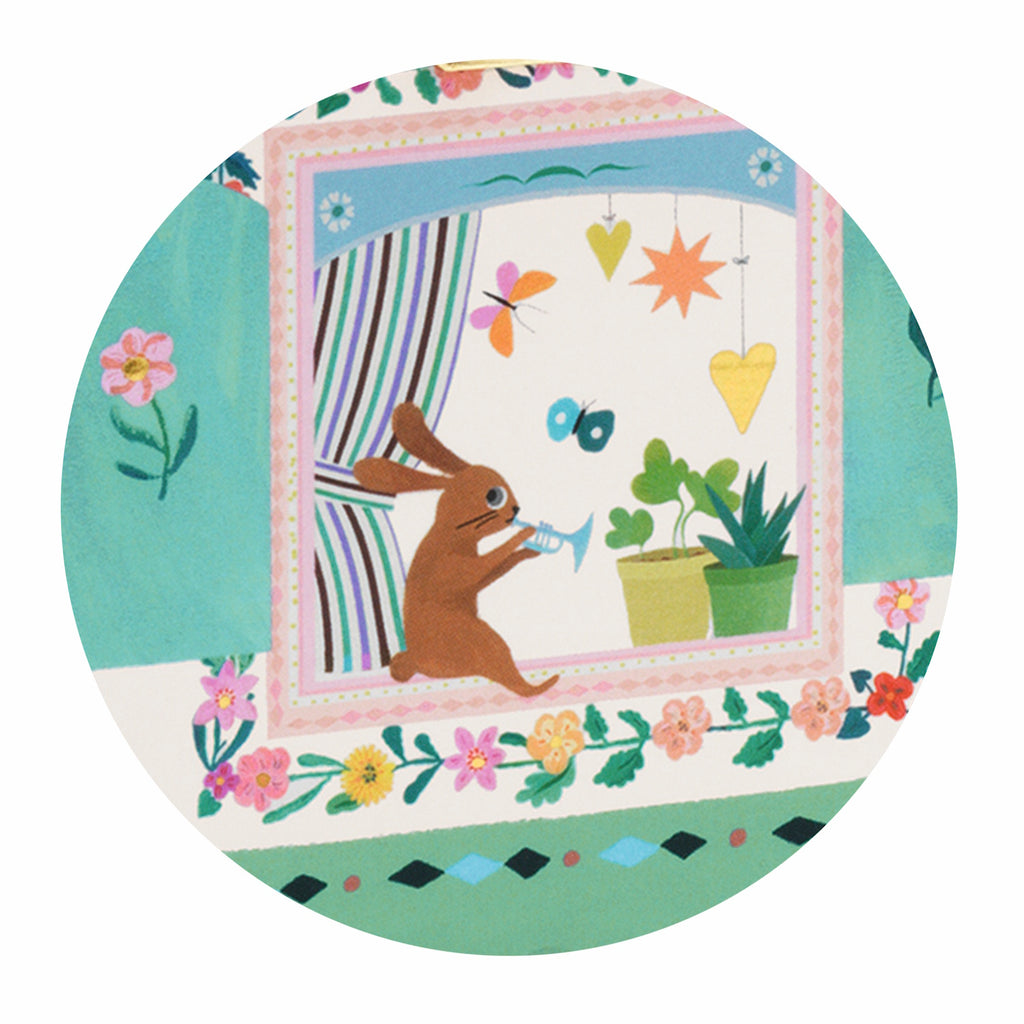 Equipped with a wind-up mechanism, the music plays when the lid is opened, and a small rabbit figurine spins as the melody plays.