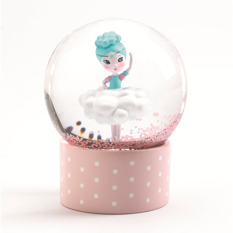 Djeco mini snow globe featuring a ballerina in a cloud tutu on a pink polka dot base with pink glitter.