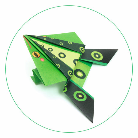 A craft kit featuring colorful paper designs and folded animal shapes like frogs and kangaroos that can hop when pressed.