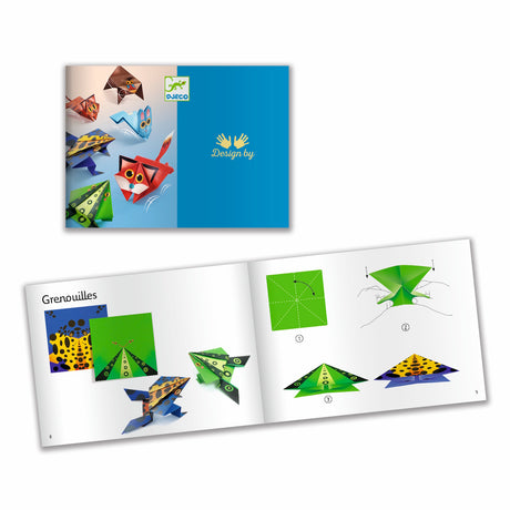 A craft kit featuring colorful paper designs and folded animal shapes like frogs and kangaroos that can hop when pressed.