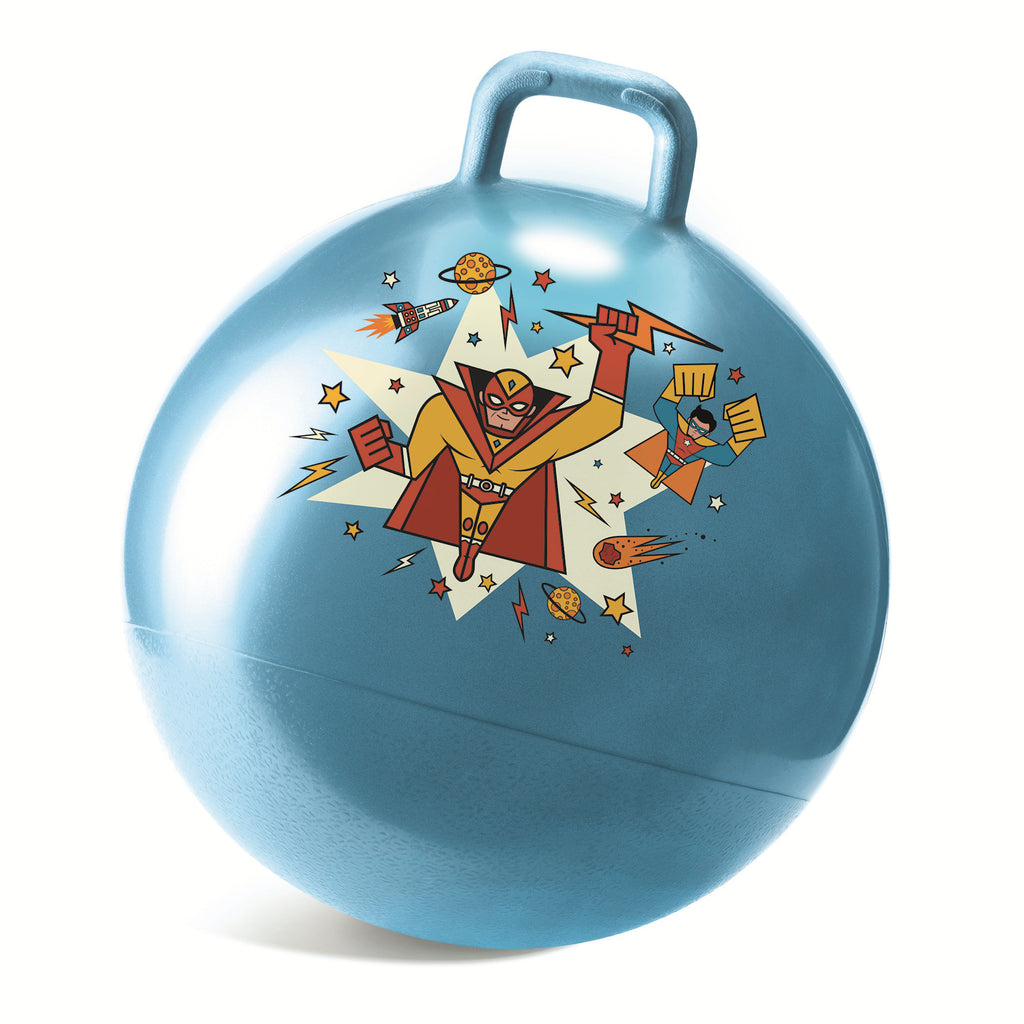 A blue space hopper features a retro superhero design. The superhero, in red and yellow, is surrounded by rockets, stars, and planets, conveying a playful, adventurous theme.
