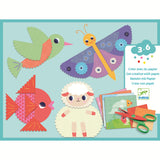 The set includes 9 illustrated sheets to cut out, 4 illustrated cards to decorate, 1 pair of crinkle-cut scissors (offering two different cutting styles), a sheet of double-sided stickers, and a step-by-step instruction booklet.