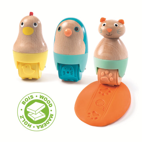 Three wooden rolling pins featuring animal designs - typically a bird, a fish, and a cat.