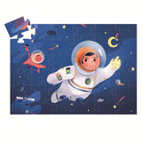 A colorful puzzle featuring an astronaut floating in space alongside a playful cat, set against a vibrant blue cosmic backdrop.