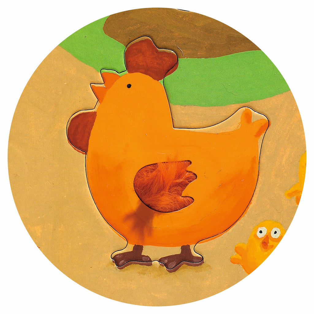 A 20-piece giant floor puzzle titled "Tactilo Farm" by Djeco, featuring eight farm animals - cow, dog, cat, rabbit, frog, bee, hen, and sheep - each with unique tactile textures such as soft, bumpy, or furry surfaces.