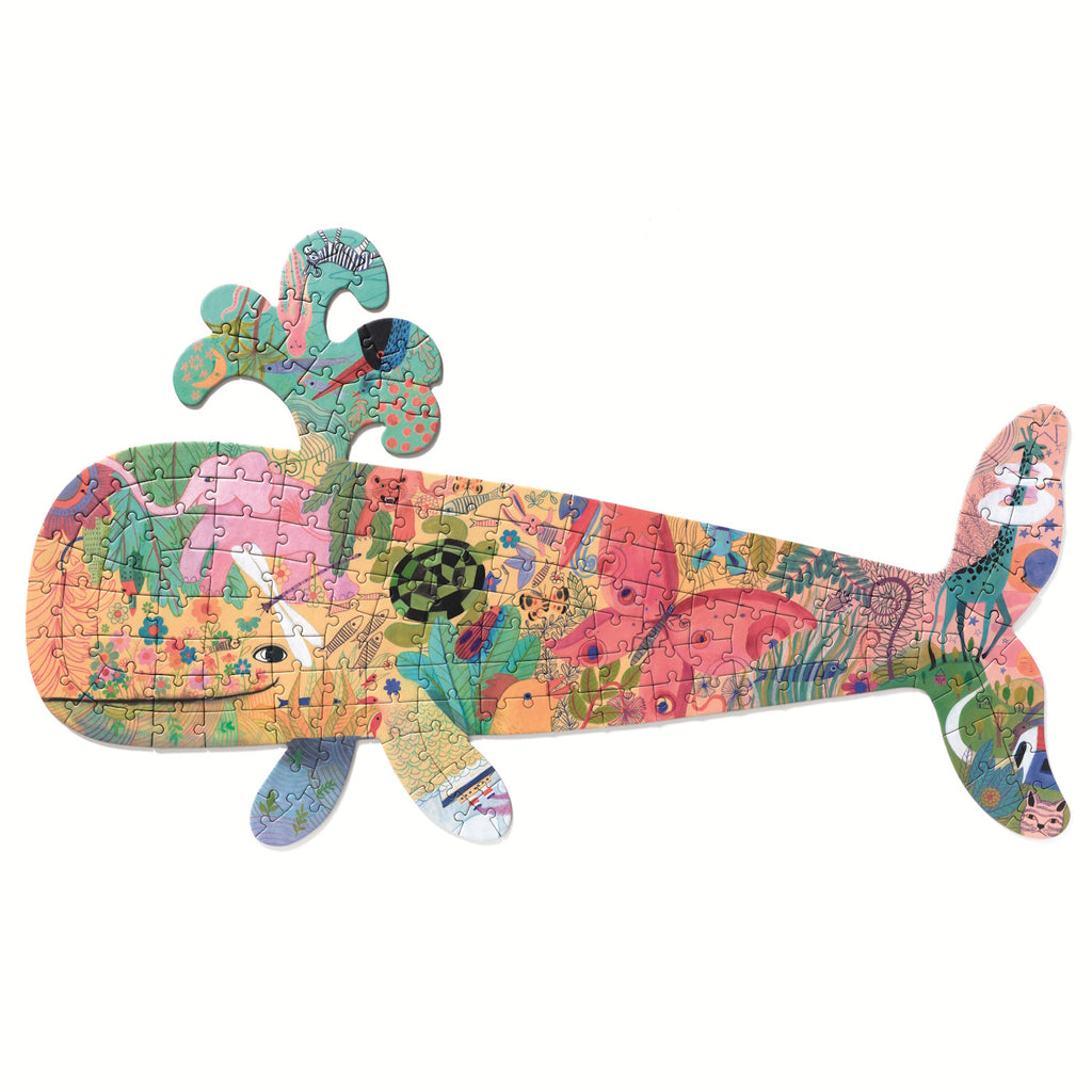 Whale-shaped puzzle with vibrant illustrations, including animals and plants. The tail features a giraffe, while splashes mimic water, creating a playful tone.