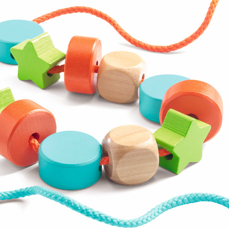 Colorful wooden beads in various shapes, designed for threading activities, packaged by Djeco.