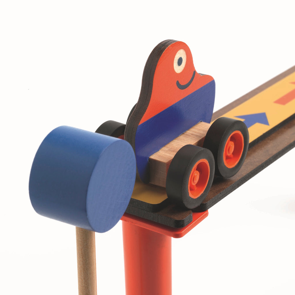 The set comprises 51 pieces, including wooden tracks, ramps, and three large wooden balls.