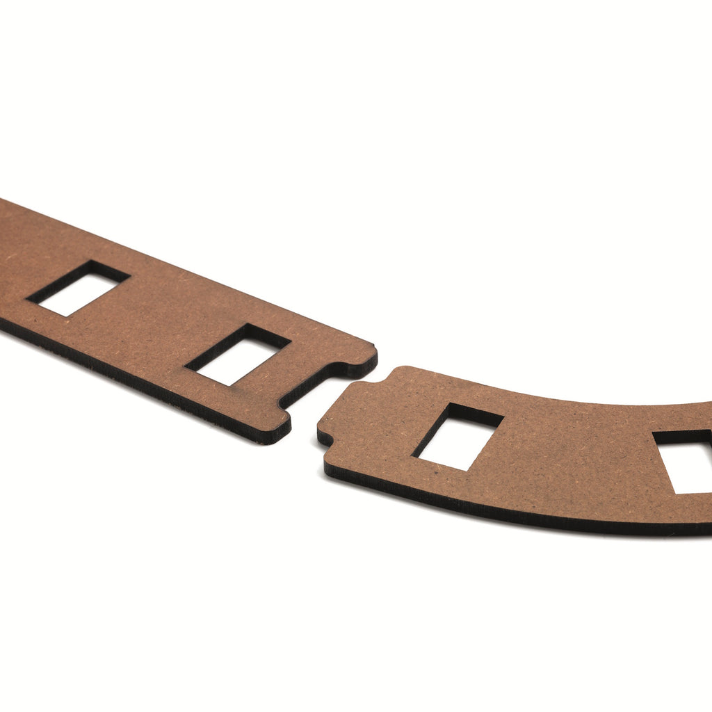 The set comprises 51 pieces, including wooden tracks, ramps, and three large wooden balls.