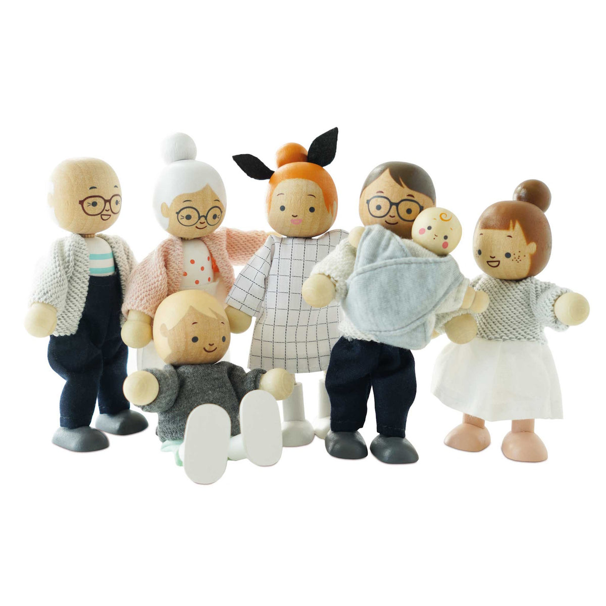 Seven wooden dollhouse family figures standing and sitting together against a white background.