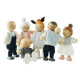 Seven wooden dollhouse family figures standing and sitting together against a white background.