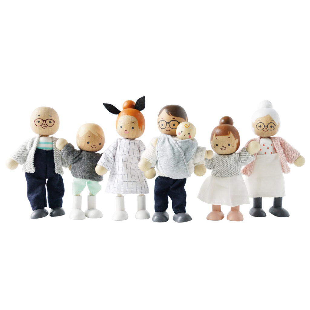 A cheerful wooden doll family with varied skin tones and outfits, including grandparents, parents, and children, all smiling joyfully together.