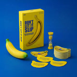 Yellow box game "Don't Let It Slip" with toy banana, hourglass timer, and banana-shaped cards.