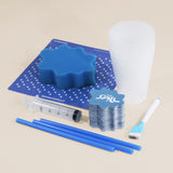 Don't Spill It game set with sponge, scorecard, syringe, plastic cups, cards, and straws.