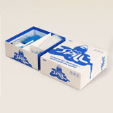 Open game box for "Don't Spill It!" showing cups, syringe, and accessories stored inside.