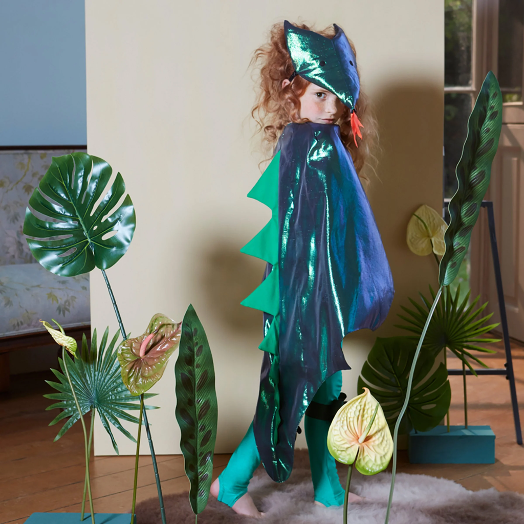 Featuring a shiny green dragon cape with fabric scales and gold accents, perfect for imaginative play and costumes.