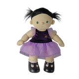 Plush doll with dark pigtails in a purple sparkly dress and black shoes, set against white background.