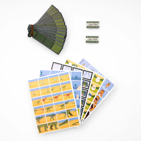 Dynamic dinosaurs flip book animation kit components including sticker sheets and film strip cards on white background.