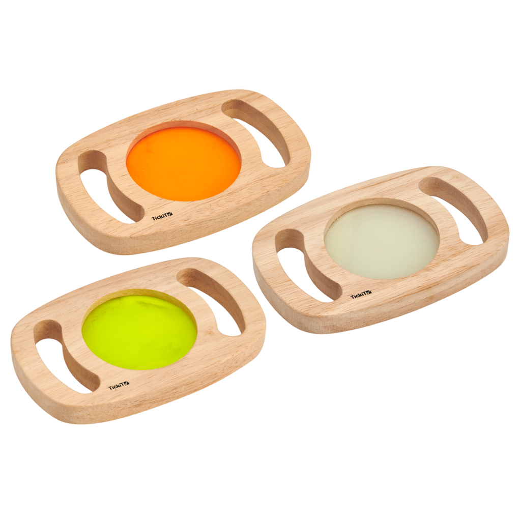 A set of handheld panels with glowing colored centers, designed for sensory play, color exploration, and visual stimulation.
