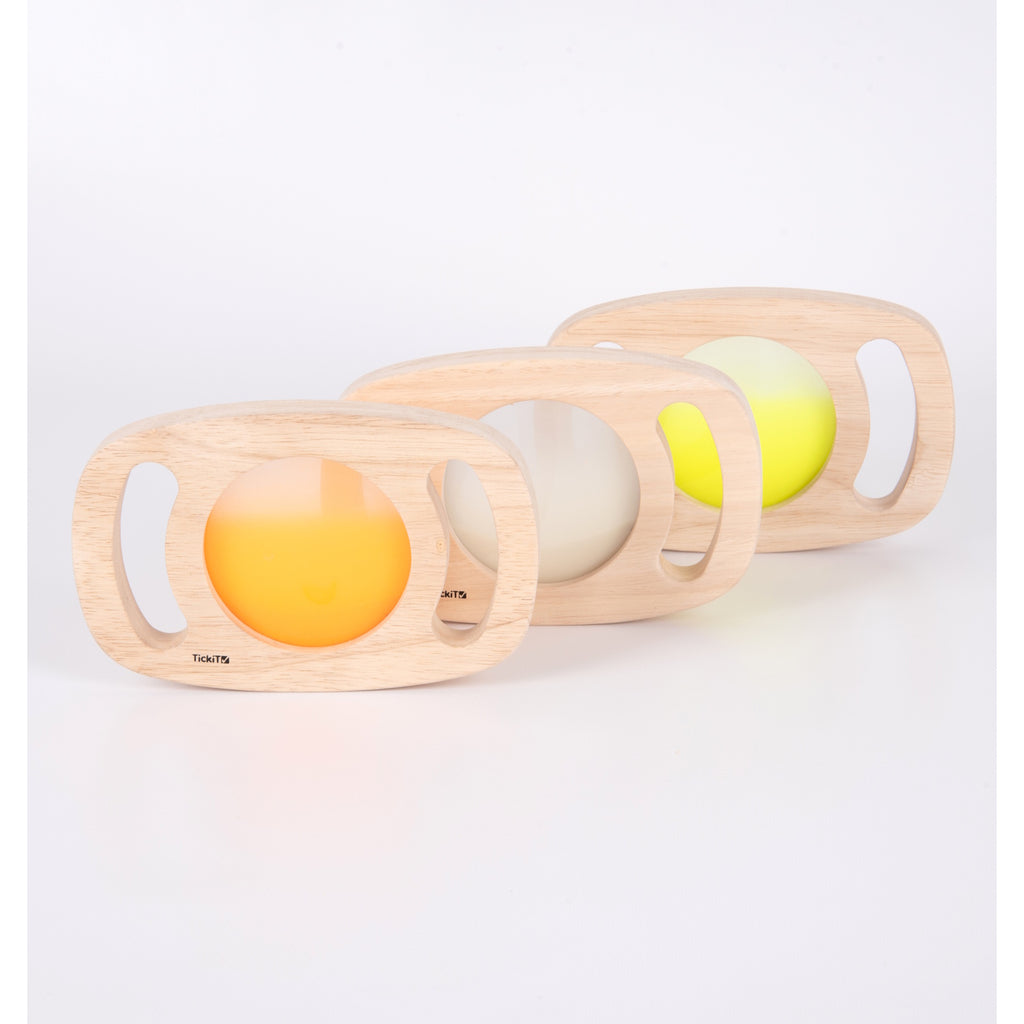 A set of handheld panels with glowing colored centers, designed for sensory play, color exploration, and visual stimulation.