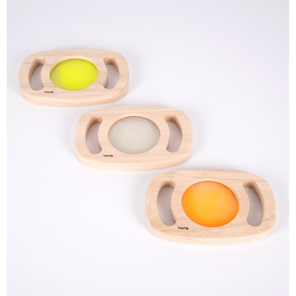 A set of handheld panels with glowing colored centers, designed for sensory play, color exploration, and visual stimulation.