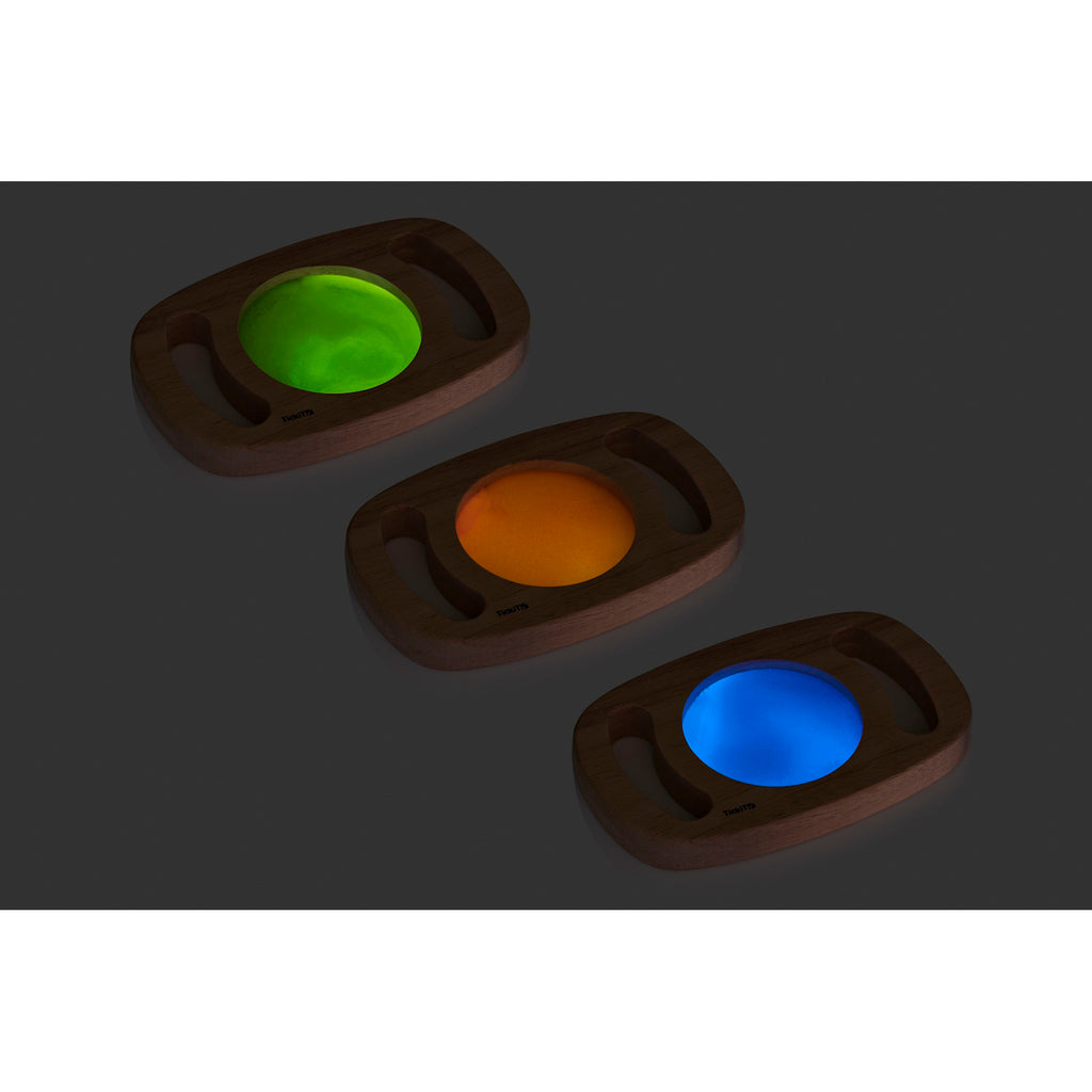A set of handheld panels with glowing colored centers, designed for sensory play, color exploration, and visual stimulation.