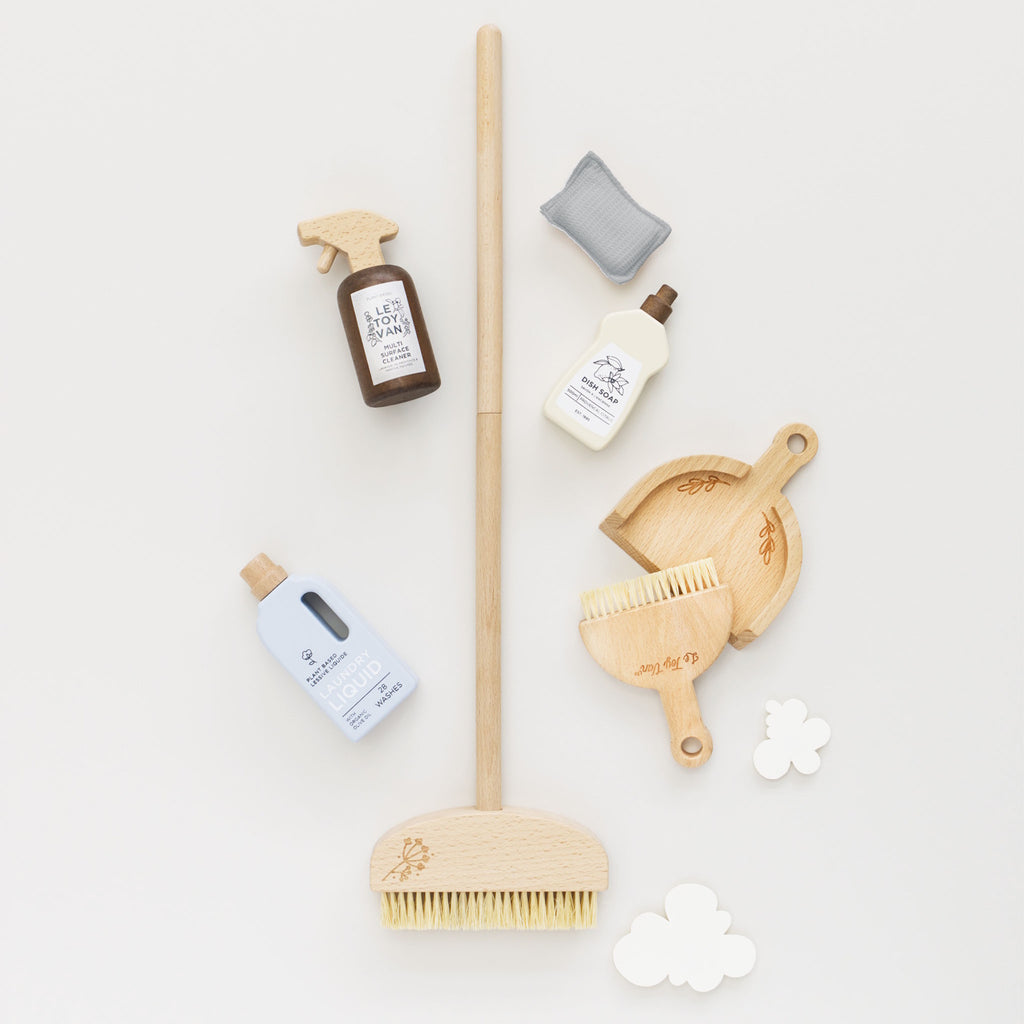 Wooden toy cleaning set featuring dish soap, multi-surface cleaner, and laundry liquid. Includes brushes and a sponge. Neutral tones, playful design.