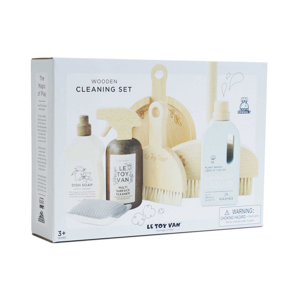 Toy cleaning set packaging with wooden brushes, spray, soap, and laundry bottle images. Text highlights eco-friendly features. Choking hazard warning included.