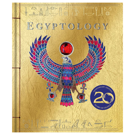 Golden book cover titled "Egyptology" features a colorful, detailed falcon with outstretched wings and a central red gem. Includes "20th Anniversary Edition" badge.