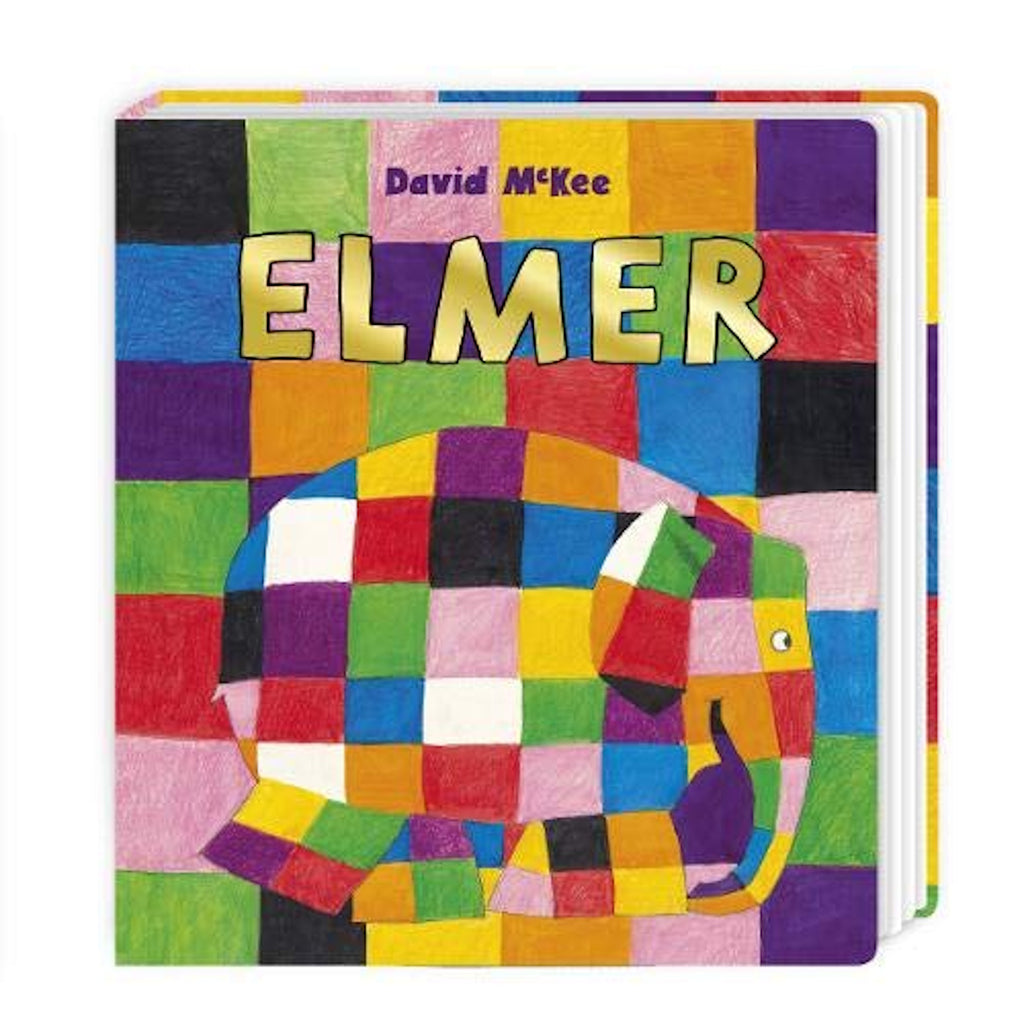 The colorful cover of "Elmer" by David McKee, a children's board book. The background of the cover is a patchwork of brightly colored squares including black, red, green, purple, pink, orange, blue, and yellow. In the foreground, the silhouette of an elephant is also made up of this same vibrant patchwork pattern.
