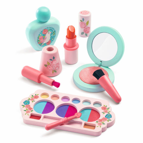 Kids wooden makeup set with floral toy eyeshadow palette, lipstick, and perfume bottle on a white background.