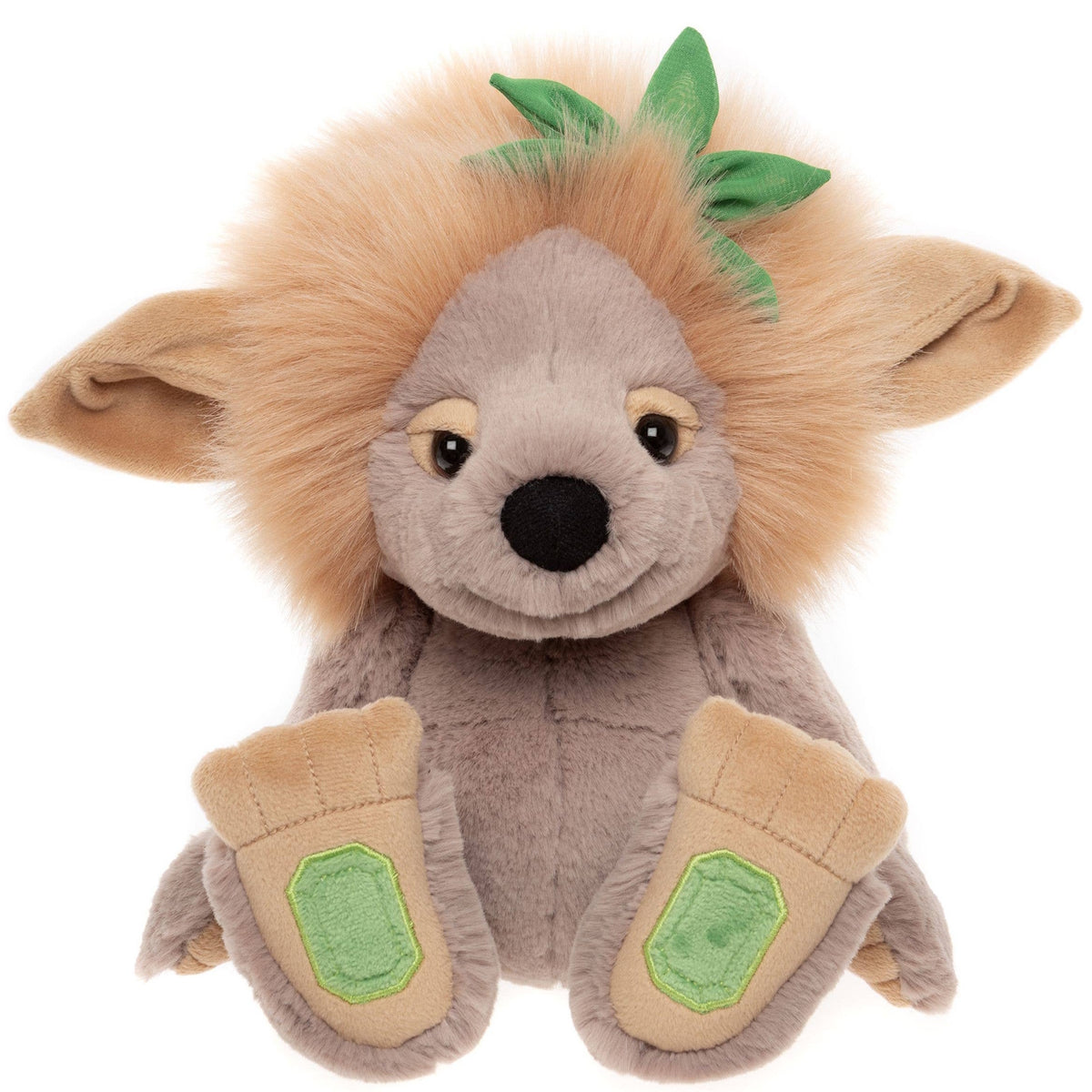 Front view of plush grey troll toy with fluffy tan mane, large floppy ears, leaf detail, and oversized feet.