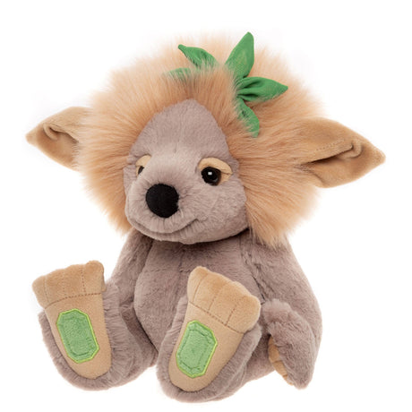 Plush grey troll toy with a fluffy tan mane, large floppy ears, green leaf accent, and large beige feet.