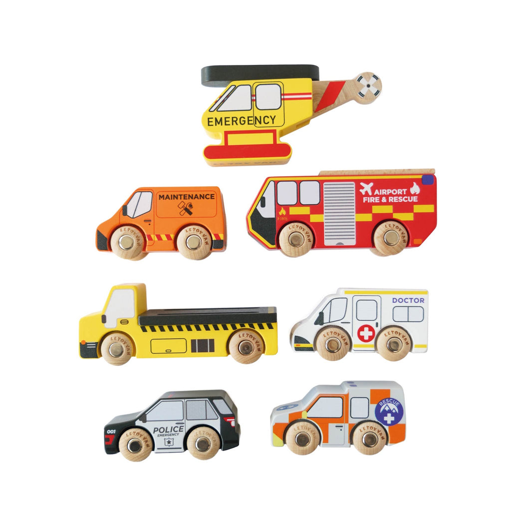 Toy wooden vehicles, including a yellow emergency helicopter, fire truck, maintenance van, dump truck, police car, ambulance, and rescue vehicle, each with colorful details.