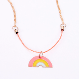Enamel rainbow necklace with a pink, yellow, and blue pendant hanging from a peach cord and gold-tone chain.