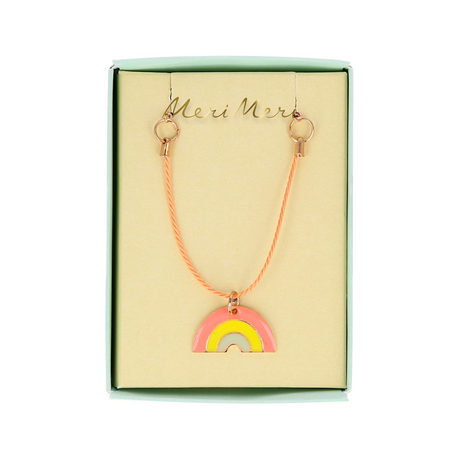 Meri Meri enamel rainbow necklace in a presentation box with an orange cord.
