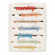 A set of enamel hair clips featuring the days of the week, perfect for adding a fun and functional touch to daily hairstyles.