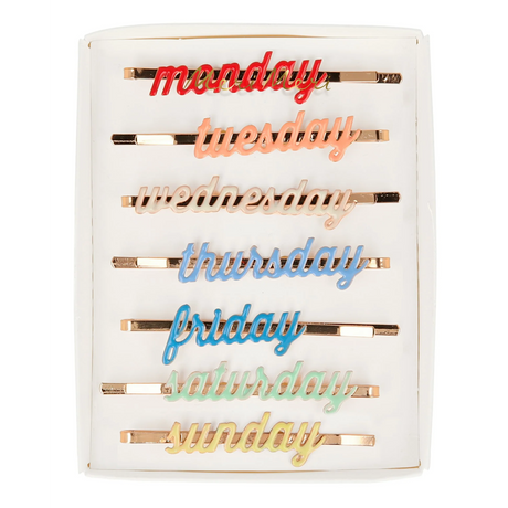 A set of enamel hair clips featuring the days of the week, perfect for adding a fun and functional touch to daily hairstyles.
