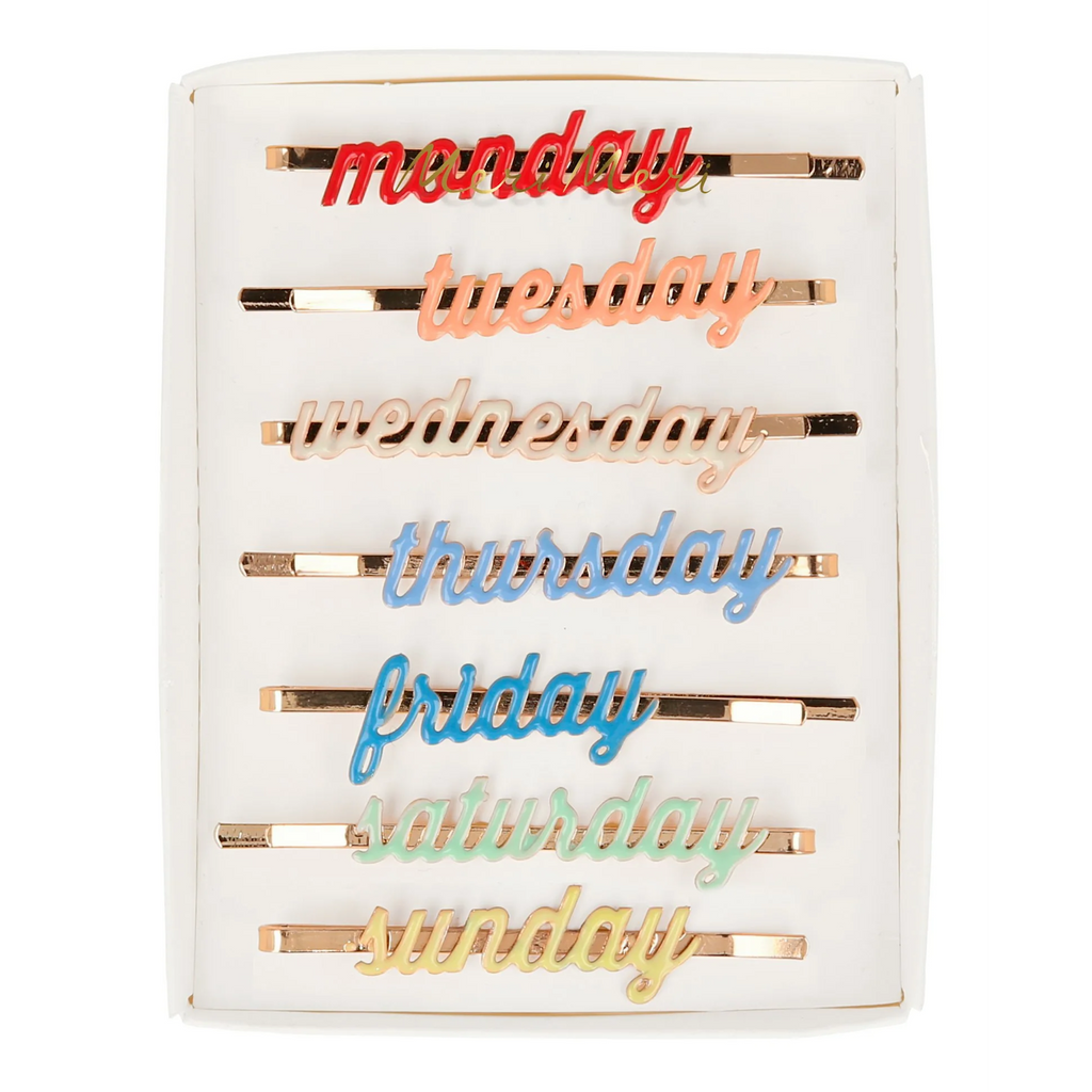 A set of enamel hair clips featuring the days of the week, perfect for adding a fun and functional touch to daily hairstyles.