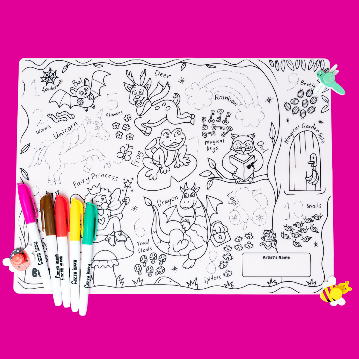 Coloring mat featuring magical creatures and characters, with five colorful markers on a bright pink background.