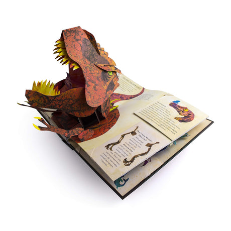 Pop-up book open to a page with a fierce, colorful 3D dinosaur head emerging. Bright colors and dynamic paper engineering create an exciting, playful tone.