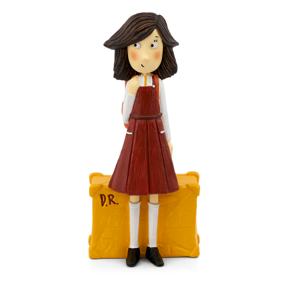 A charming figurine of a girl with brown hair, wearing a red dress and standing beside a yellow suitcase marked "D.R.".