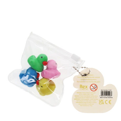 A clear bag holding four colorful rubber duck toys: pink, green, yellow, and blue, alongside a yellow duck keychain tag.
