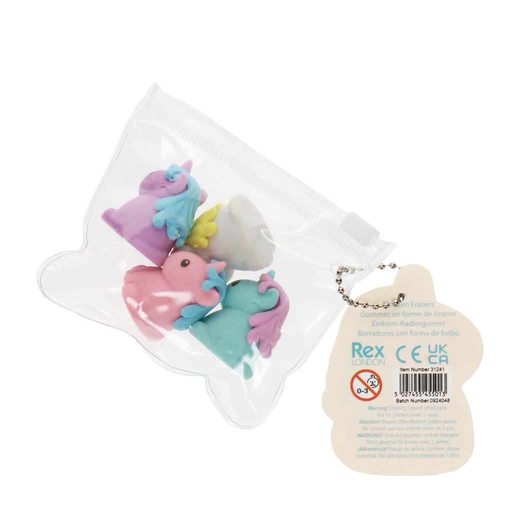A transparent pouch containing colorful unicorn erasers in pink, blue, purple, and white, with a unicorn-shaped tag attached.