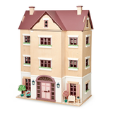 Closed multi-storey wooden dollhouse featuring a front door, windows, and potted plants.