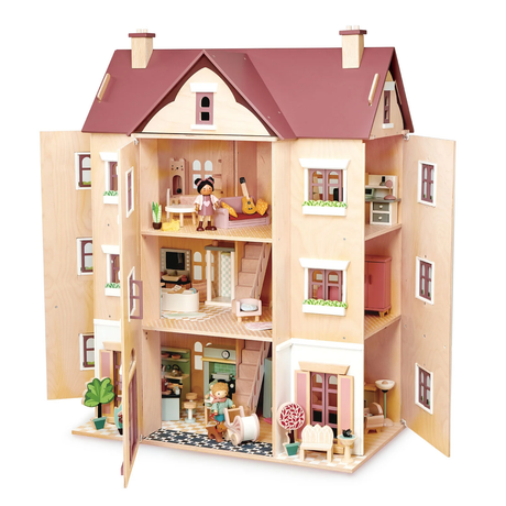 Large multi-storey wooden dollhouse open on all sides showing furnished interior rooms.