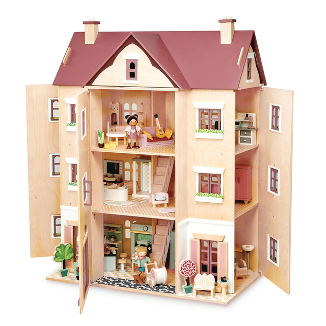 Large multi-storey wooden dollhouse open on all sides showing furnished interior rooms.
