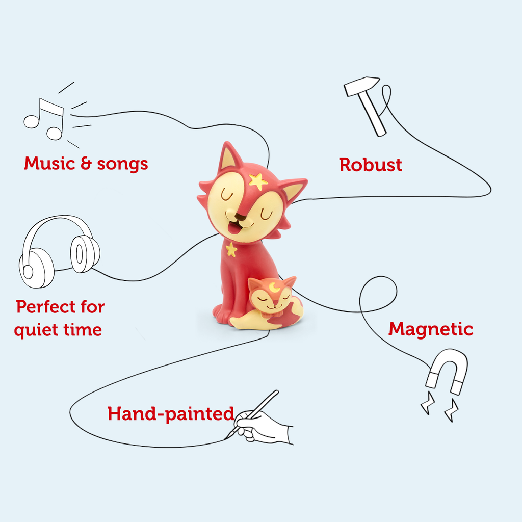 A playful red cat and its sleeping kitten figurine, exuding a whimsical charm.