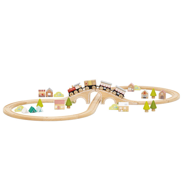 Wooden figure-of-eight train set with a bridge, train cars, trees, tents, and small buildings.