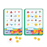 Two colorful game boards with grids display whimsical illustrations and emotions like joy and chaos. Yellow star counters and emotion cards lie below, creating a playful, engaging atmosphere.